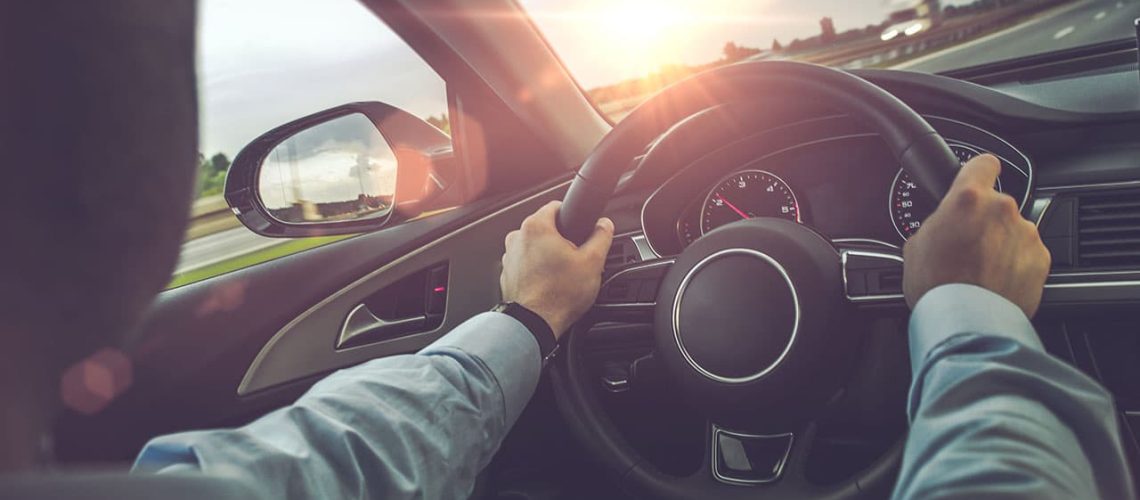 Highway Car Driving. Caucasian Men Behind the Wheel on His Road Trip.